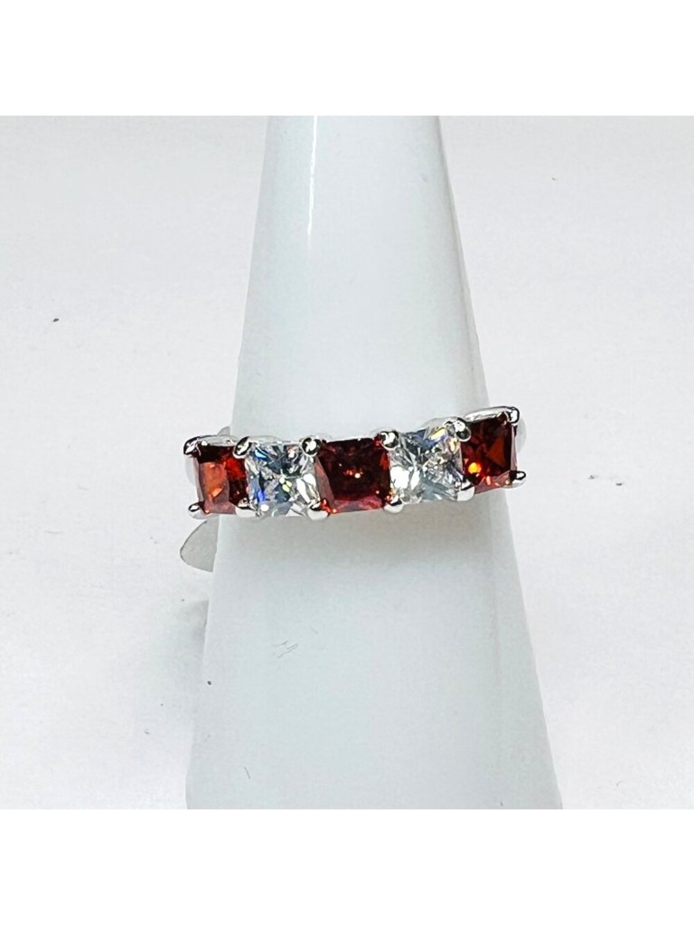 Ring Bomb Party Ring, NWOT, Size 7, red and clear gemstones silver color band